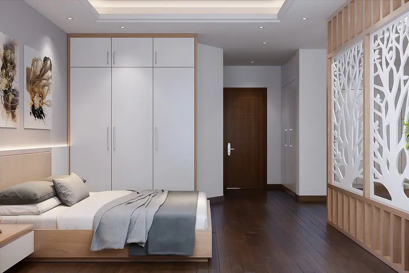 Quarto claro com cama baixa, armário embutido e porta de madeira ao fundo