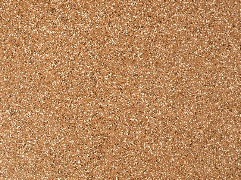 Superfície de cortiça vista bem de perto, com os grânulos marrons aparentes